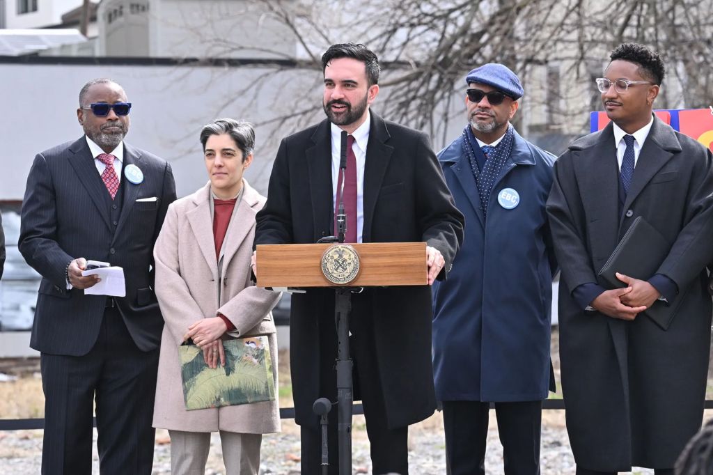 An image collage containing 1 images, Image 1 shows Mayor Zohran Mamdani speaking at a press conference on affordable housing in Brooklyn on March 25, 2026