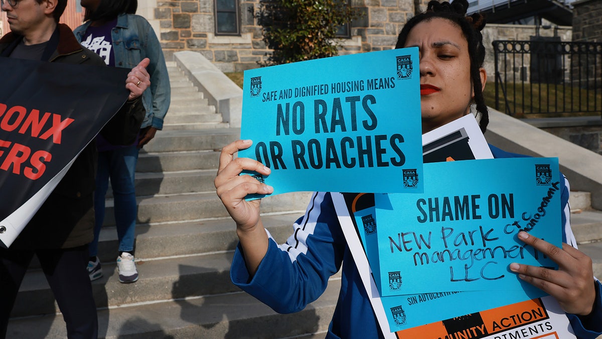 People attend a rally before a "Rental Ripoff" hearing at Fordham University in the Bronx