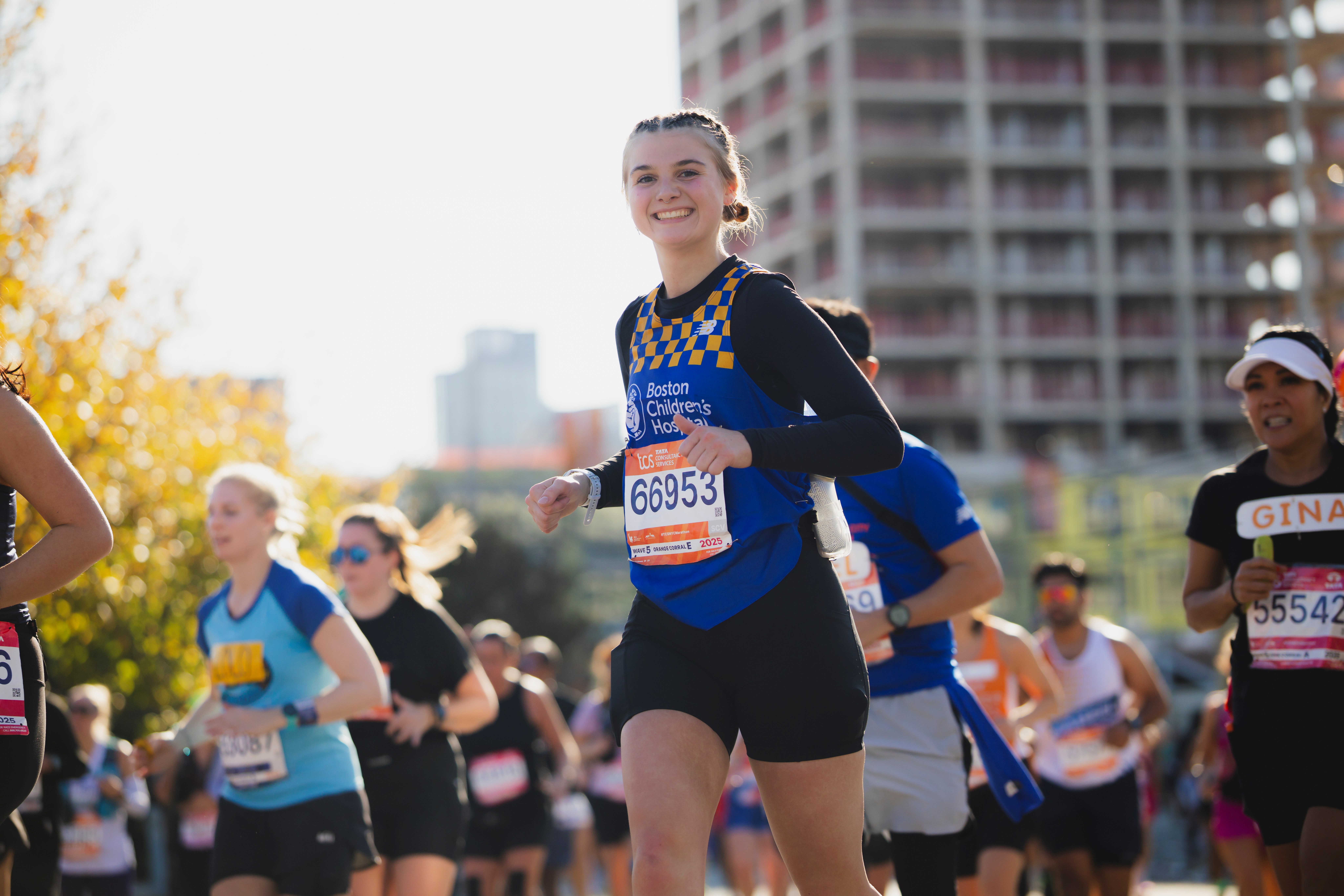 Woman charity runner at 2025 TCS NYC Marathon