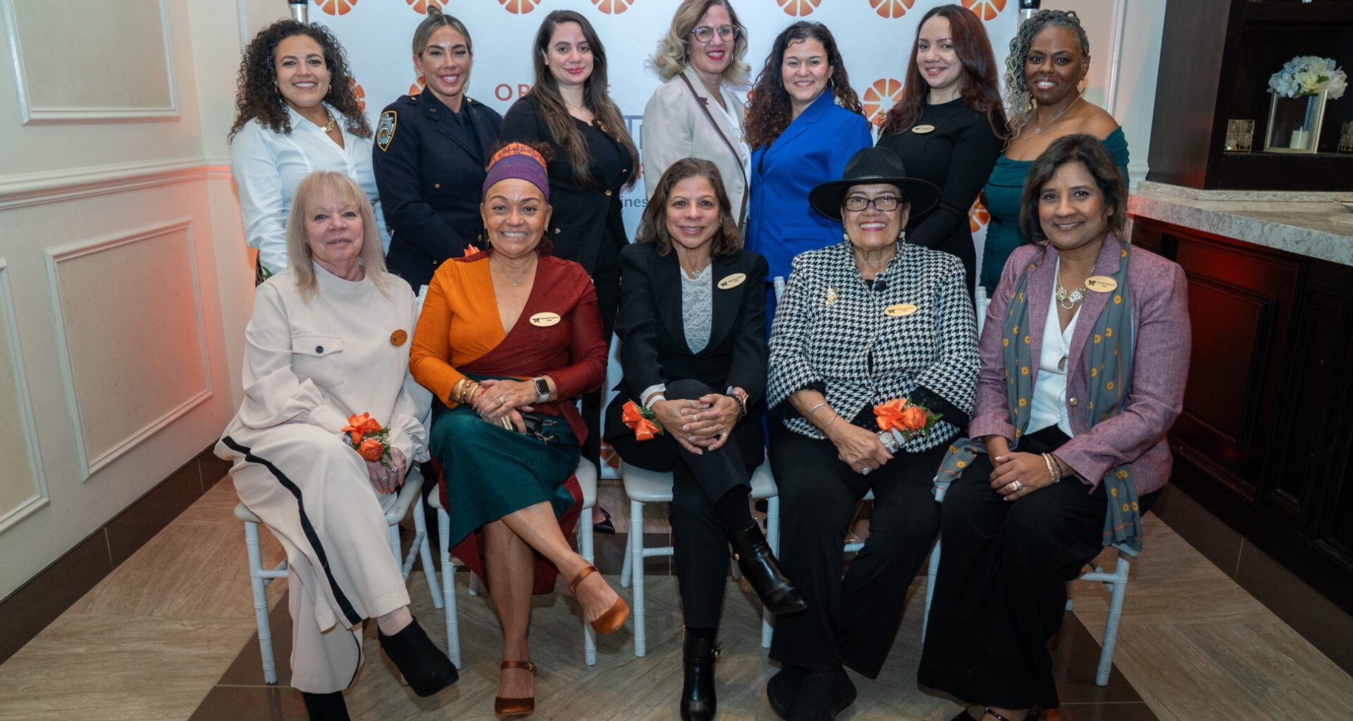 Front Row L-R: Laura Guerriero, Publisher, The Bronx Times; Elizabeth Figueroa, AVP for Community Relations, The New York Botanical Gardens; Olga Luz Tirado, President, O Communications & Solutions and Board Member, Orange Bank & Trust Company; Anna Vincenty, Community Liaison/Special Projects, Nos Quedamos, Inc.; Vanessa Baijnauth, VP/Relationship Manager, Orange Bank & Trust Company; Back Row L-R: Senator Nathalia Fernandez; Detective Kandice Hall; Rachel Batista-McChain, CEO & Founder, Paralegals FTC, Inc.; Angela Colon, Partner, Lemle & Wolff Companies; Anivelca Cordova, Principal, Lemle & Wolff Companies; Swannie Batista, President & Founder, Paralegals FTC, Inc.; Zelda Strong-Diaz, Auditor, NYS Office of Medicaid Inspector General