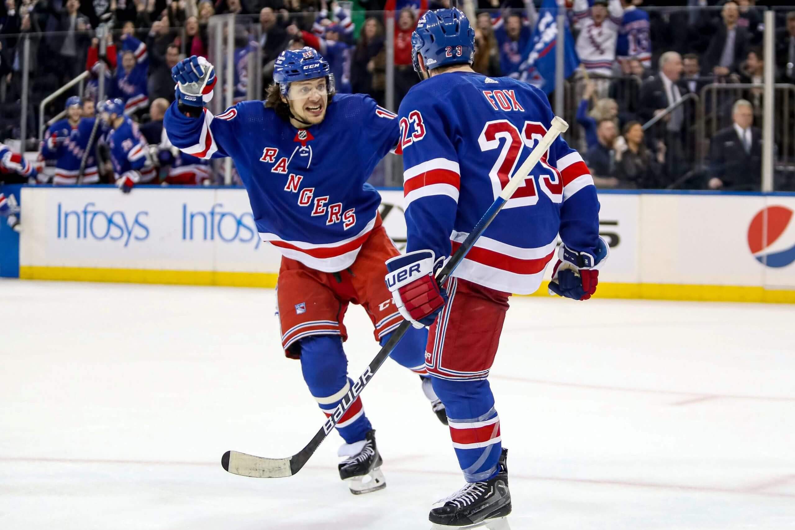 New York Rangers left wing Artemi Panarin (10) celebrates a game-winning goal by defenseman Adam Fox (23) in overtime against the Dallas Stars at Madison Square Garden on Jan. 12, 2023.