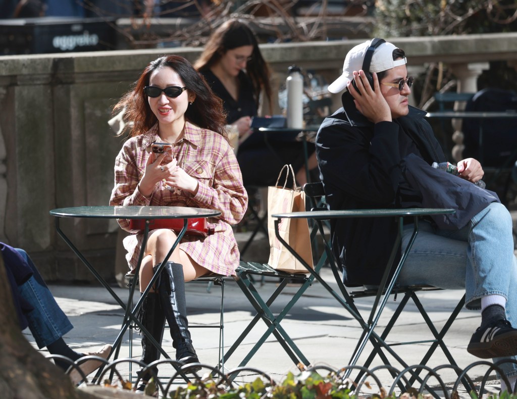 People enjoying the first warm and sunny day in Bryant Park.