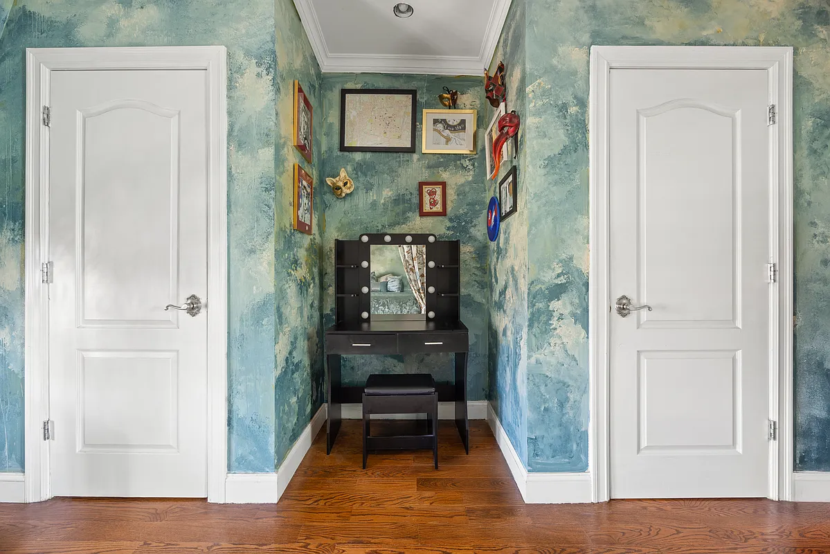 bedroom with blue swirled wallpaper