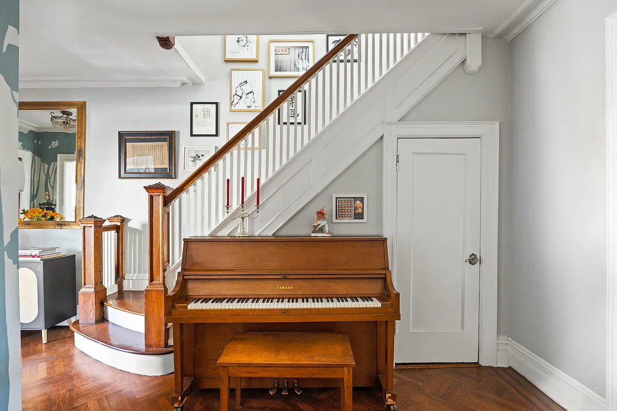 entry hall with original stair, closet under stair