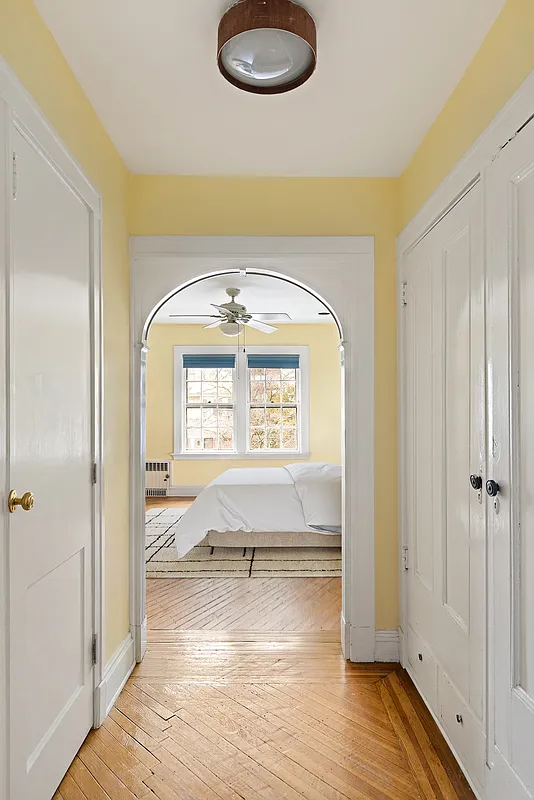passthrough with closets and view to a bedroom