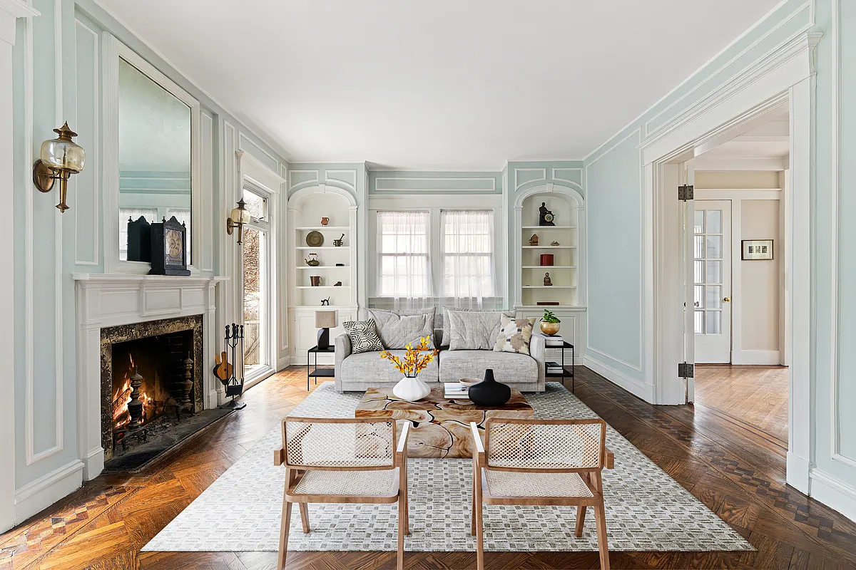 parlor with wall moldings, built-in bookcases
