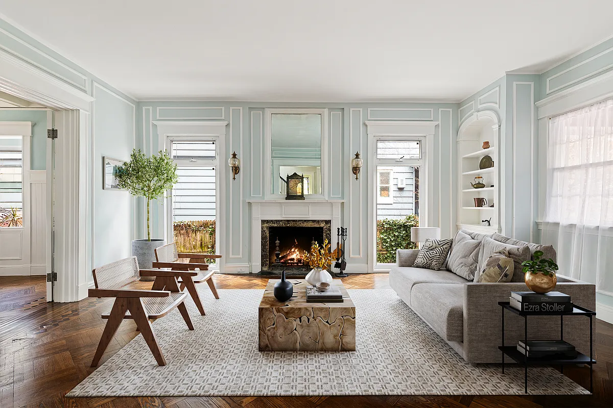 parlor with wall moldings, mantel