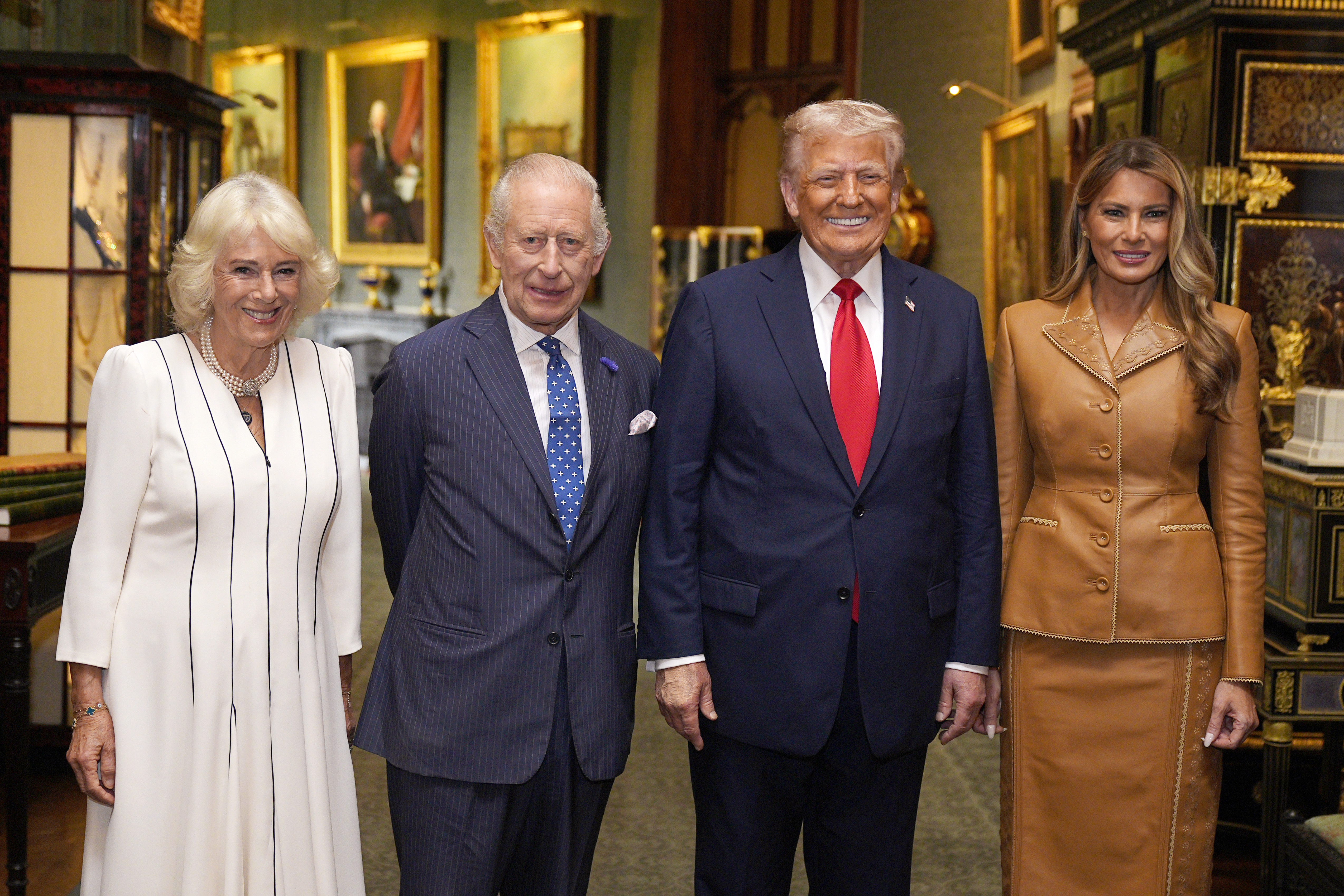 Queen Camilla, King Charles, Donald Trump and Melania Trump standing in a row and smiling