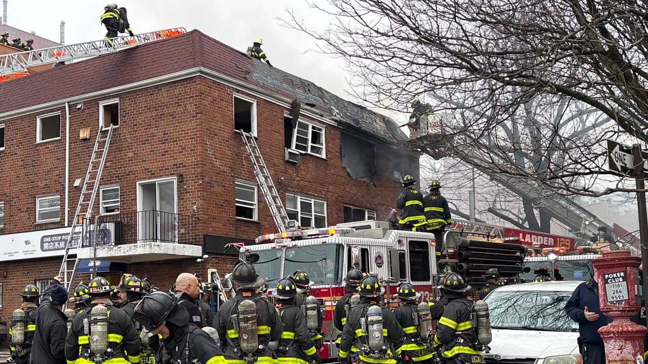 Just before 12:30 p.m., a call was made for a fire at 44-49 College Point Boulevard between Avey and Pople avenues in a three-story apartment building in Flushing, officials said. (Spectrum News NY1/Kenneth Kaplan)