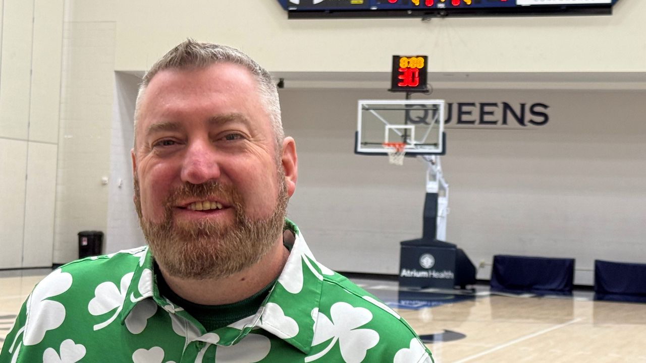 Queens University men's basketball coach Grant Leonard talks to the media on Tuesday, March 17, 2026, at the Levine Center's Curry Arena i Charlotte, N.C., as his team prepares for their first round NCAA Tournament game against No. 2 seed Purdue. (AP Photo/Steve Reed)