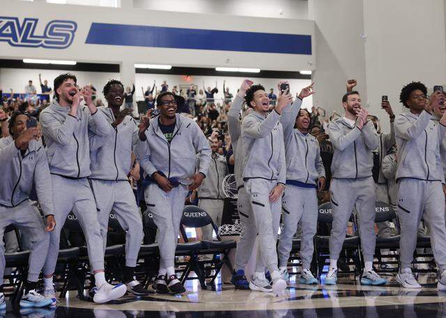The Queens University of Charlotte men’s basketball team celebrates while viewing the NCAA selection show on CBS on Sunday, March 15, 2026, at Curry Arena. They are a No. 15 seed and will play Purdue. 