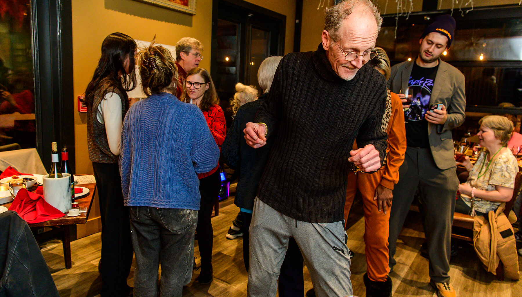 Harvey Weiss, center, dances during a Granpods event at Carter’s in Beacon on Feb. 19. The group organizes social outings for older people to combat social isolation.
