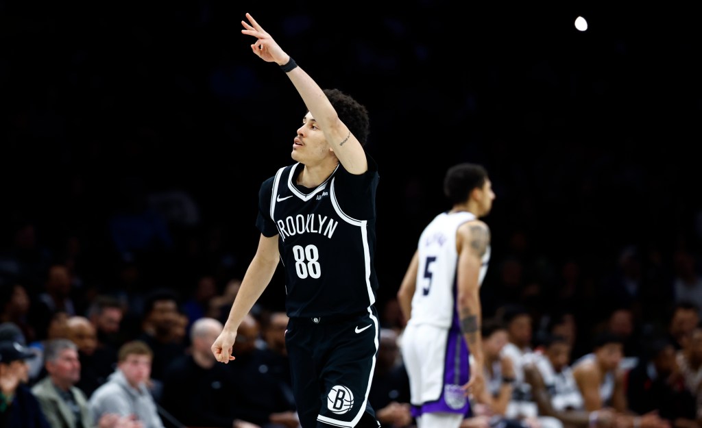 Nolan Traore of the Brooklyn Nets reacts after making a three-point shot against the Sacramento Kings.
