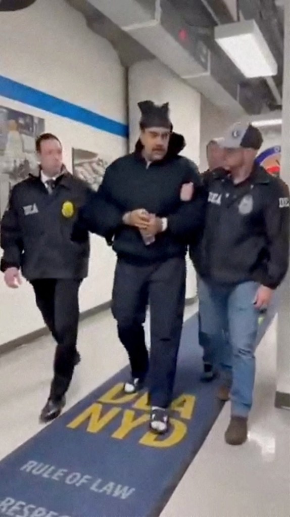 Venezuela's President Nicolas Maduro walked in custody by DEA agents.