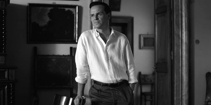 Andrew Scott as Tom Ripley leaning on a chair in Episode 5 of Netflix's Ripley.