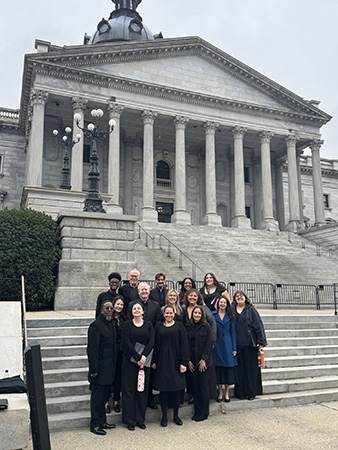 Royal Voices of Charlotte group on steps of SC Capital building