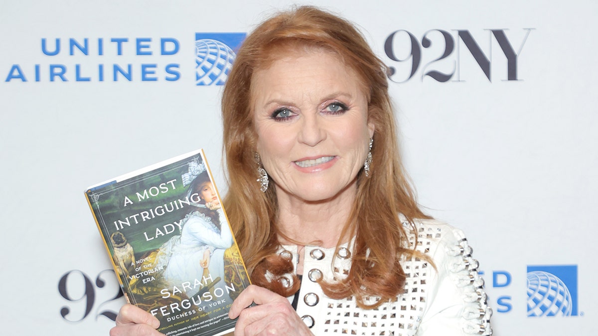 Sarah Ferguson holding her historical novel.