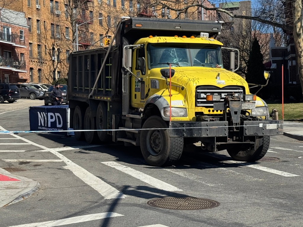 The scene where a woman, believed to be in her 30s, was struck and killed by a DOT dump truck at Metropolitan Avenue and Lefferts Blvd in Queens, Tuesday, March 10, 2026.