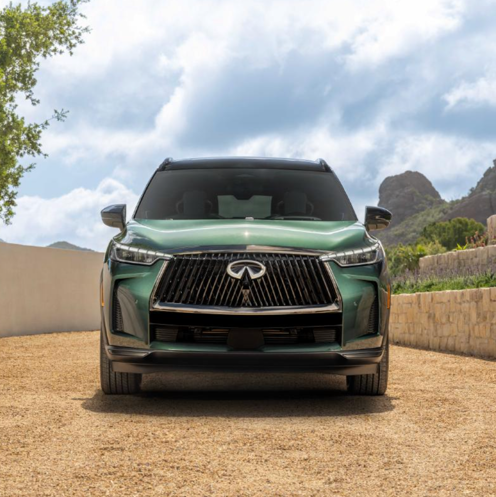 person in a car interior highlighting a water bottle and an award