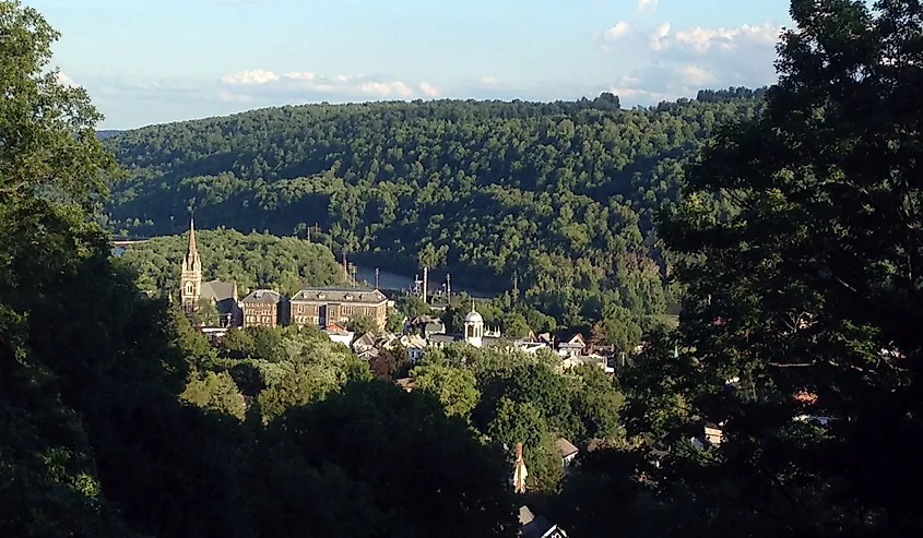 The small town of Little Falls, New York, is seen from a high point over its steeples and the Erie Canal.