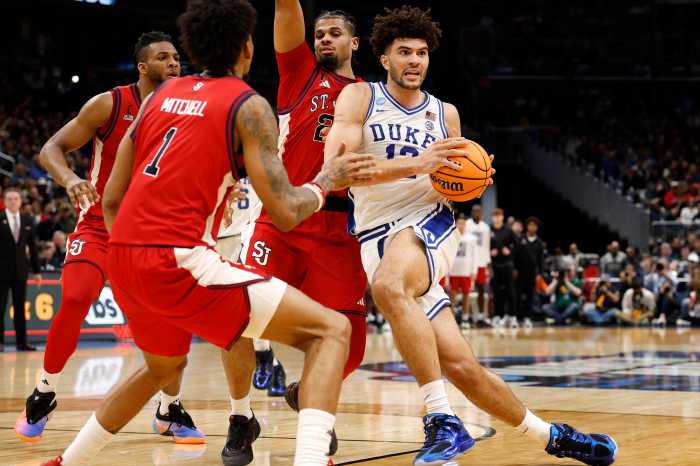 Mar 27, 2026; Washington, DC, USA; Duke Blue Devils forward Cameron Boozer (12) dribbles the ball past St. John's Red Storm forward Zuby Ejiofor (24) in the first half during a Sweet Sixteen game of the East Regional of the men's 2026 NCAA Tournament at Capital One Arena. 