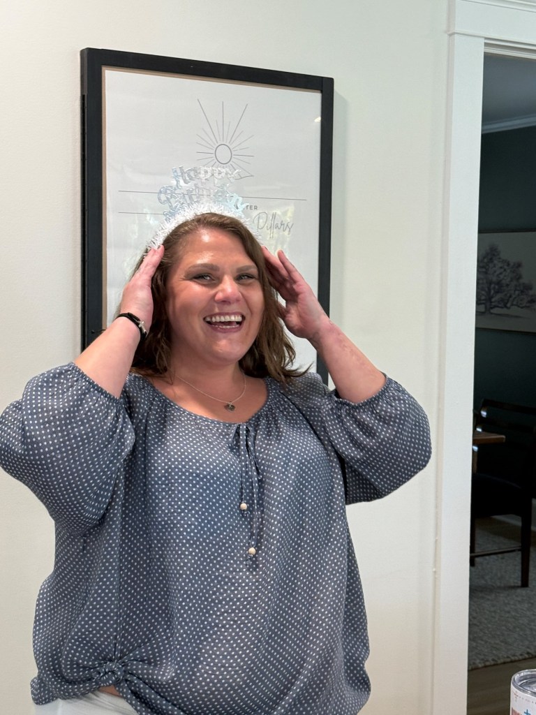 Stephanie Nicole Minter smiling and wearing a "Happy Birthday" crown.