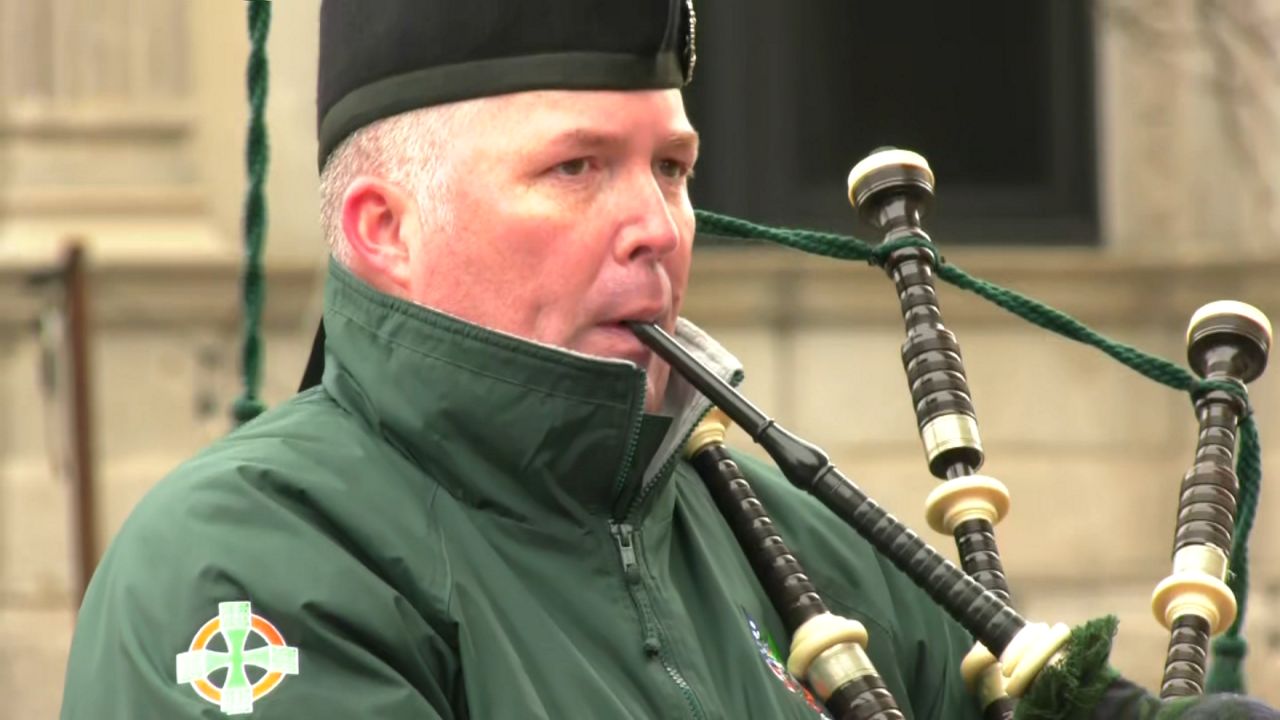 bagpiper playing before syracuse st. patrick's day parade