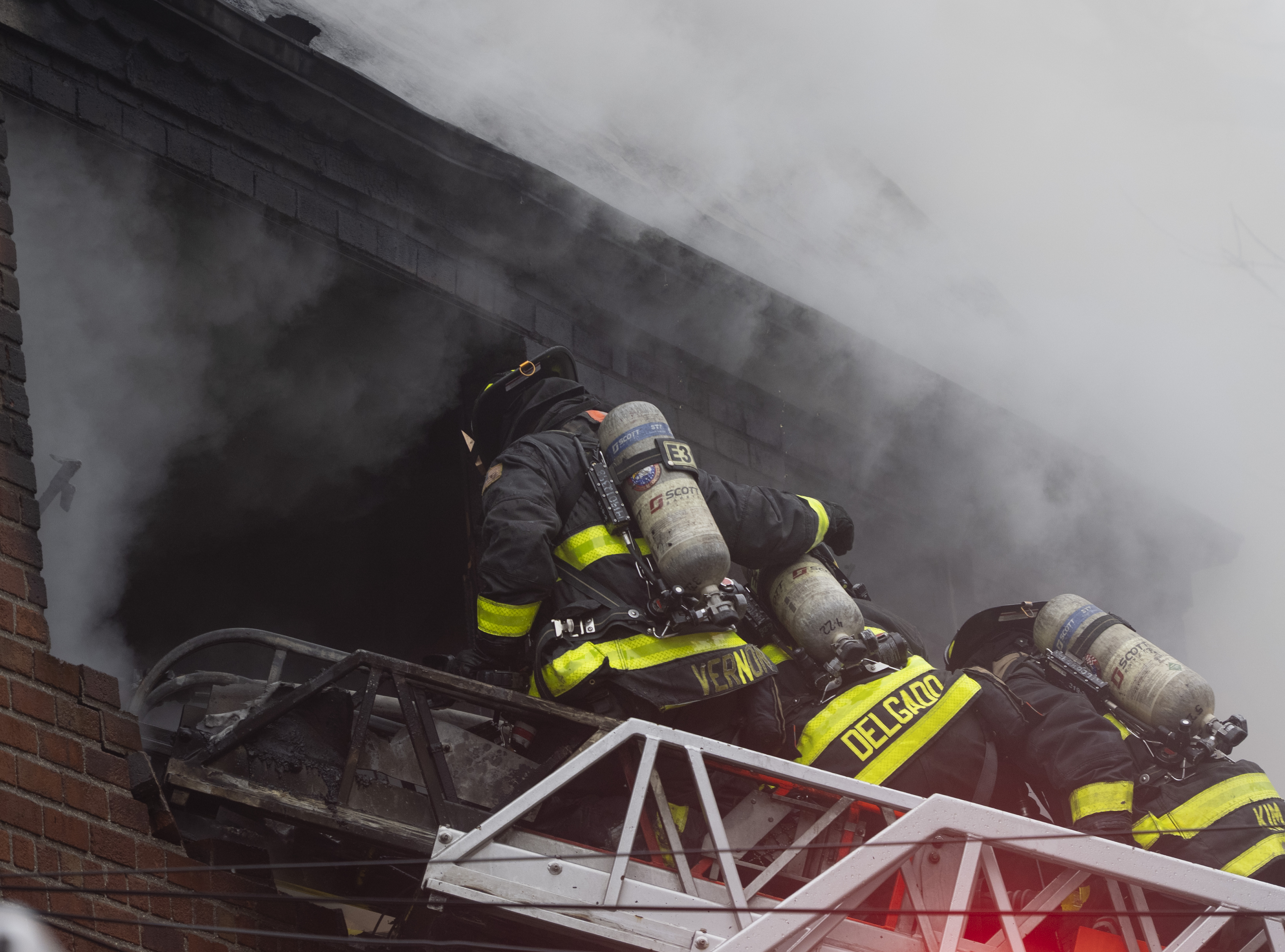 Firefighters at the scene of a fatal four-alarm fire in Flushing on March 16.