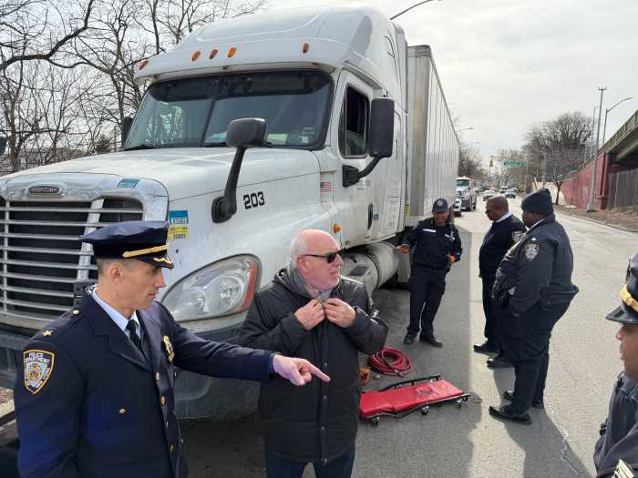 Assembly member Michael Benedetto and NYPD overseeing the tow operation on March 2.