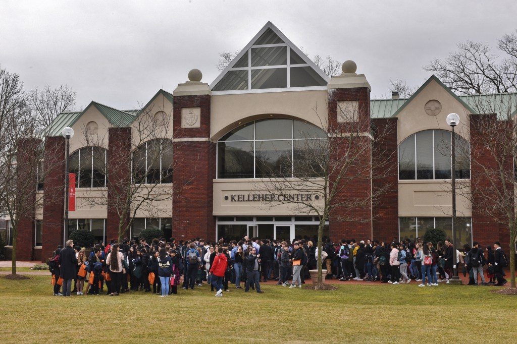 A crowd of students stand outside the Kelleher Center at St. John's University in Staten Island.