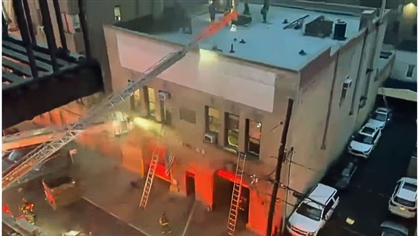 Three-alarm fire at Bronx firehouse injures two after trapped firefighter report