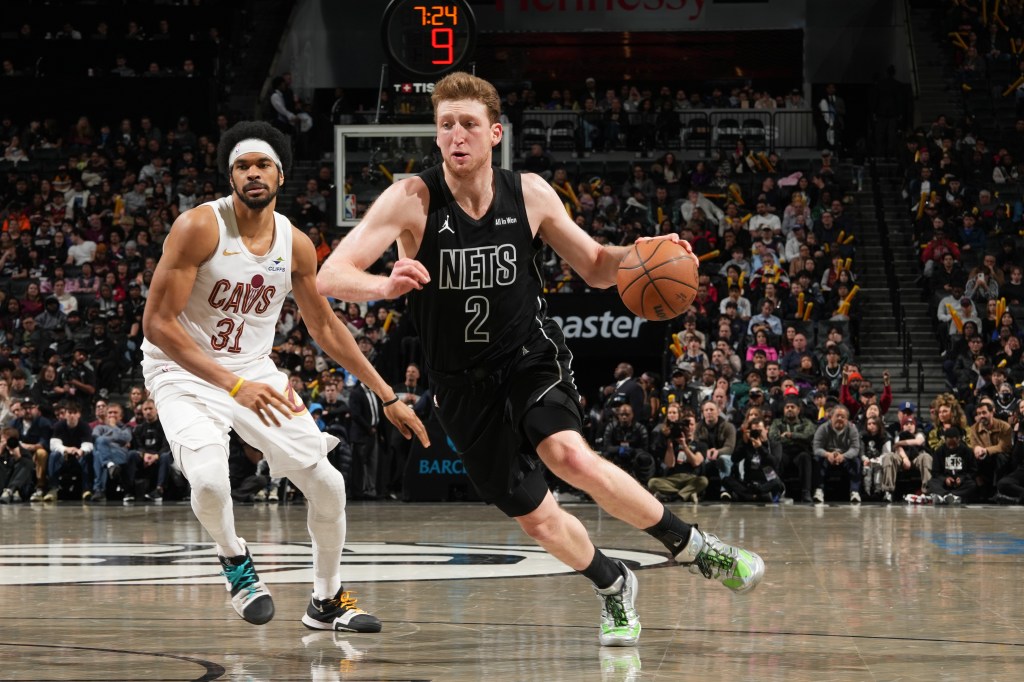 Danny Wolf dribbles the ball for the Brooklyn Nets against the Cleveland Cavaliers.