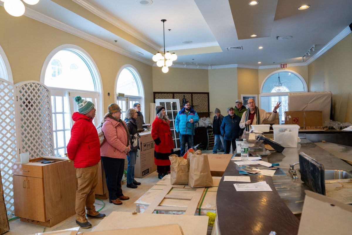 Jason Gerard (right), general manager of Weekender Hotels, giving a tour of the former Copperfield Inn, then becoming the Phoenix Inn, in downtown North Creek. It is now being completely renovated.