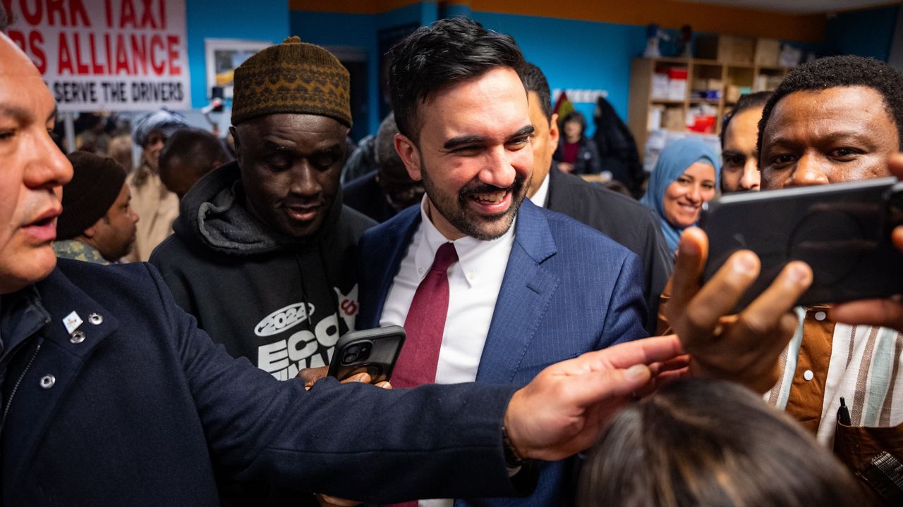 People greet and take photos with New York City Mayor Zohran Mamdani at a Ramadan Iftar hosted by his team at the New York Taxi Workers Association, Wednesday, March 18, 2026, in New York. (AP Photo/Angelina Katsanis)