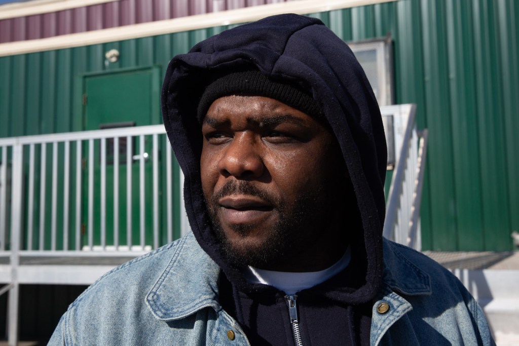 Teddy Green waits to visit his relative on Rikers Island.