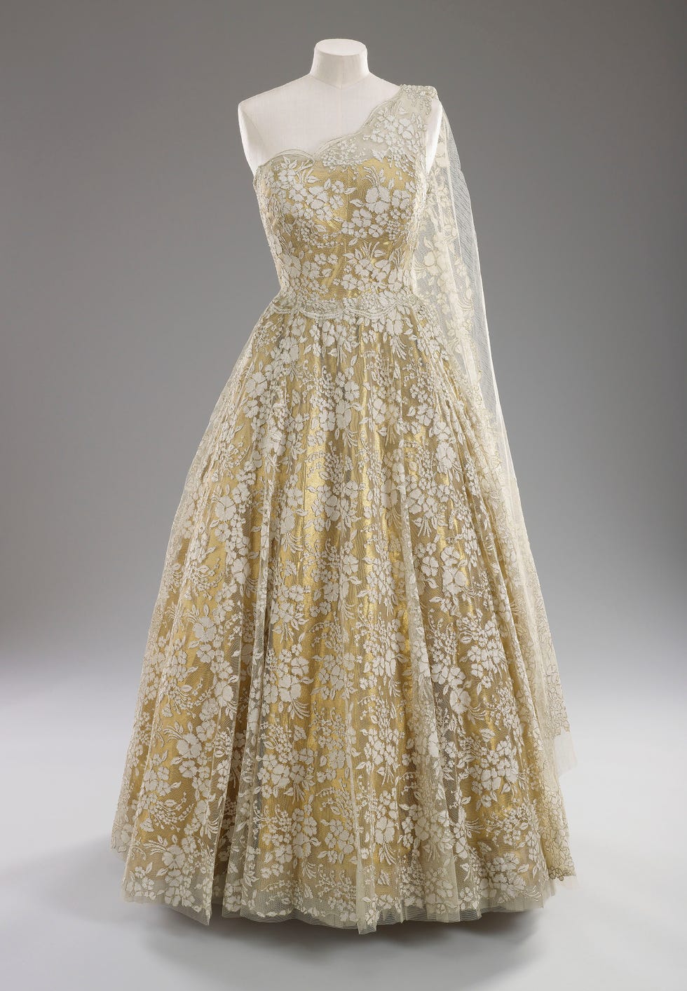 formal gown with floral lace design and a single shoulder strap