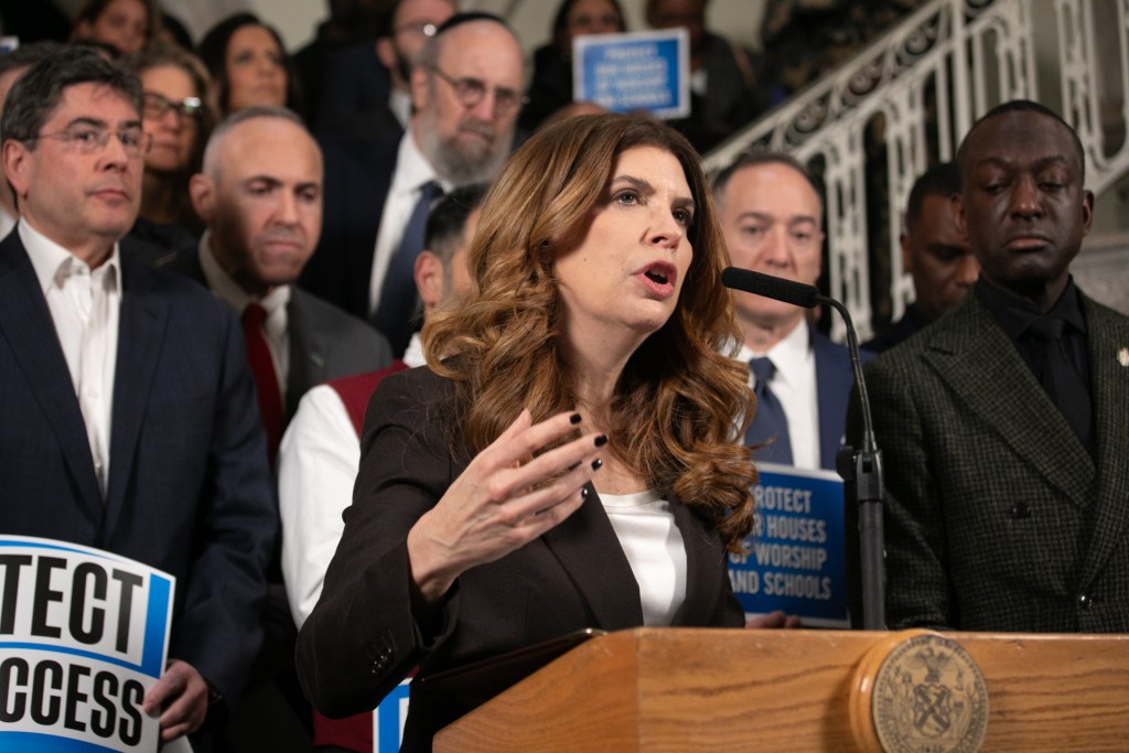 Council Speaker Julie Menin (D-Manhattan) speaks at a City Hall press conference about a bill to create a buffer zone for protests around houses of worship,