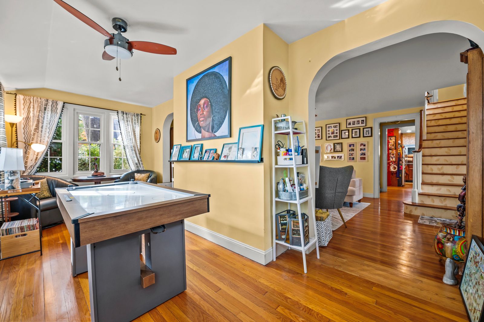 Image may contain Corner Indoors Interior Design Floor Flooring Wood Furniture Table Hardwood and Shelf