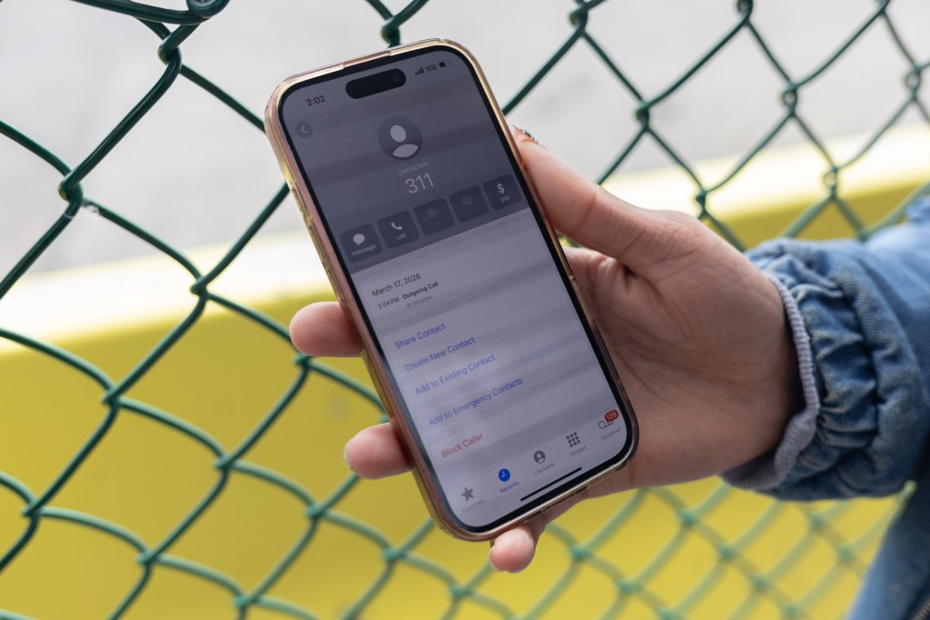 A woman visiting her fiancé on Rikers Island shows a 311 call she made to complain about conditions he was facing,