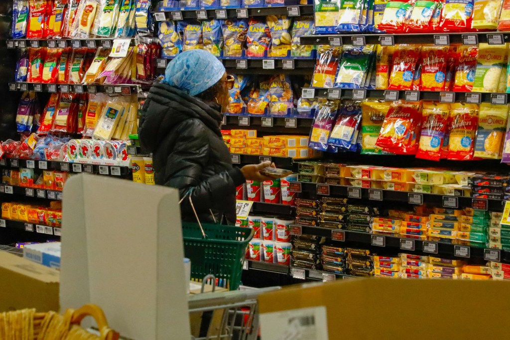 People shop at a Fine Fare supermarket in Harlem,