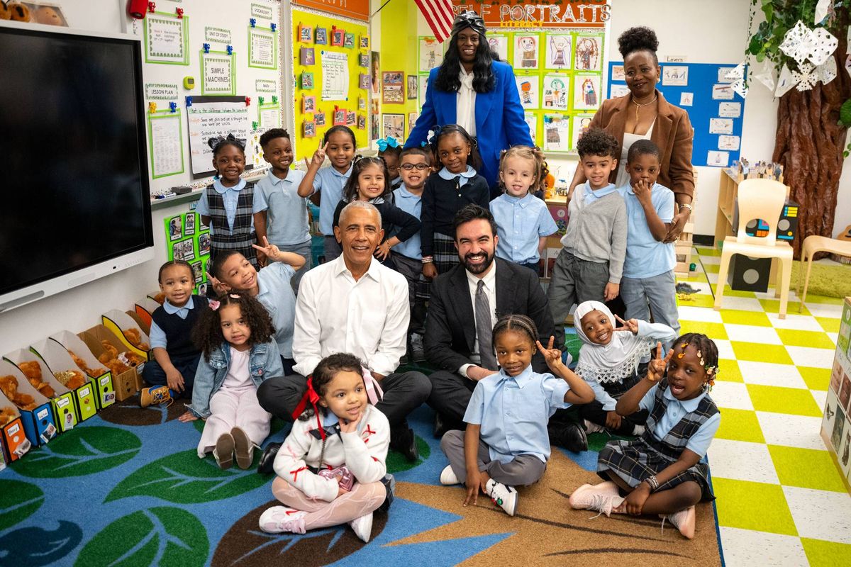 Obama and Mayor Zohran Mamdani pose for a photo with children at Learning Through Play Pre-K in New York