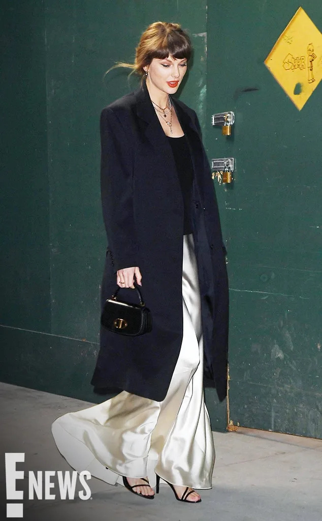 <p><span>The 36-year-old may have initially stepped out in a stylish tank, but she was covered up with a black coat thanks to New York City's unpredictable springtime weather.</span></p>