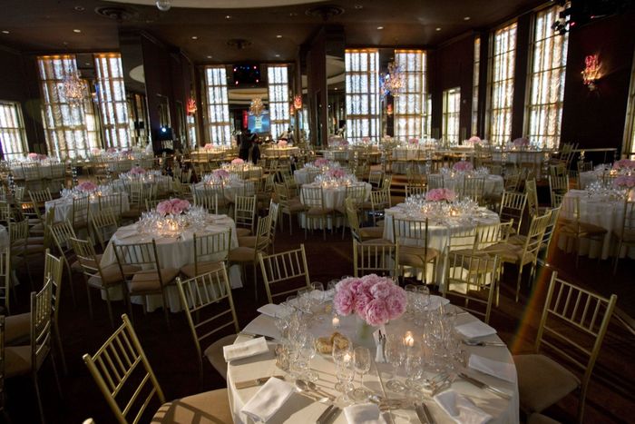 The Rainbow Room elegantly set for a gala with pink peony centerpieces and gold chiavari chairs, Rockefeller Center, New York City, USA