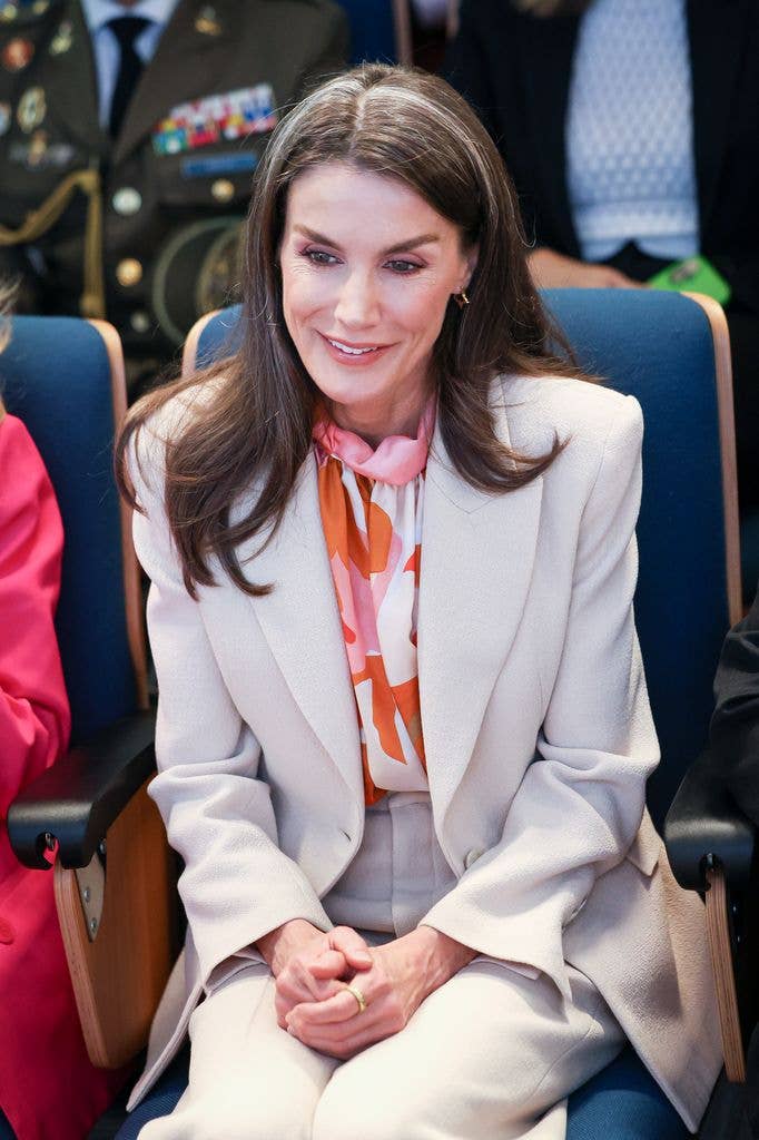 Close up of Queen Letizia in Hugo Boss suit and printed blouse