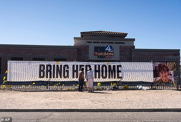 A large banner is seen here surrounded in yellow ribbons outside the KVOA Newsroom in Tucson, Arizona
