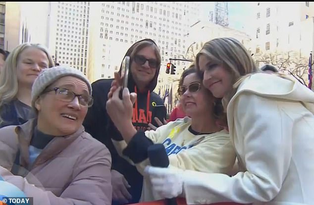 Savannah posing for a selfie with a supporter outside the Manhattan Today studio on Monday