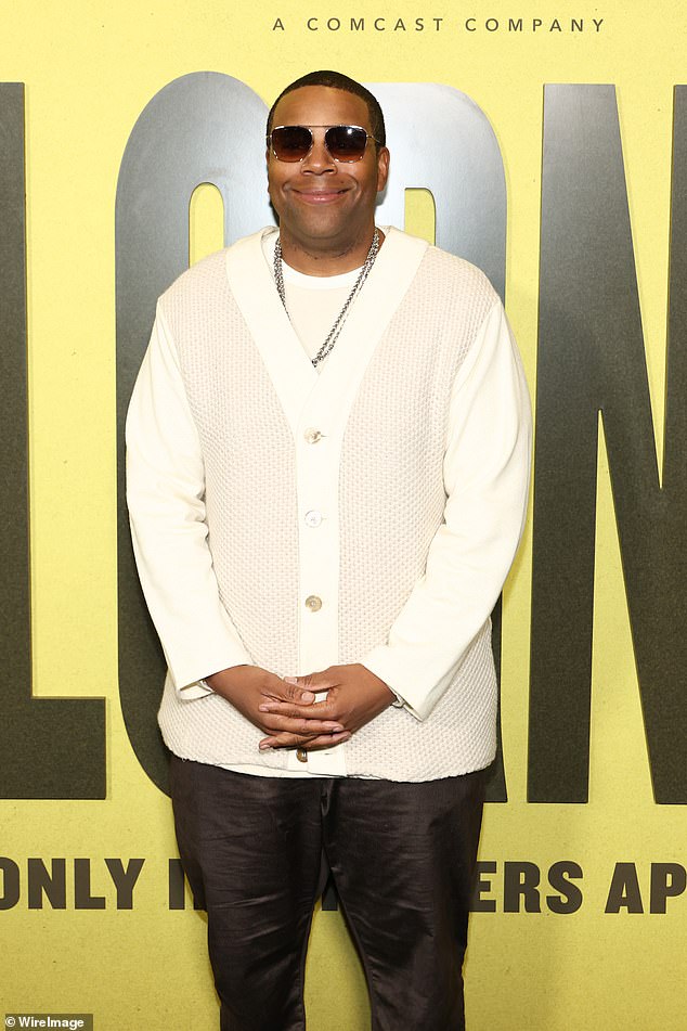 Saturday Night Live star Kenan Thompson posed up in a stylish cream color-blocked cardigan, which he paired with silver chain necklaces and dark brown slacks