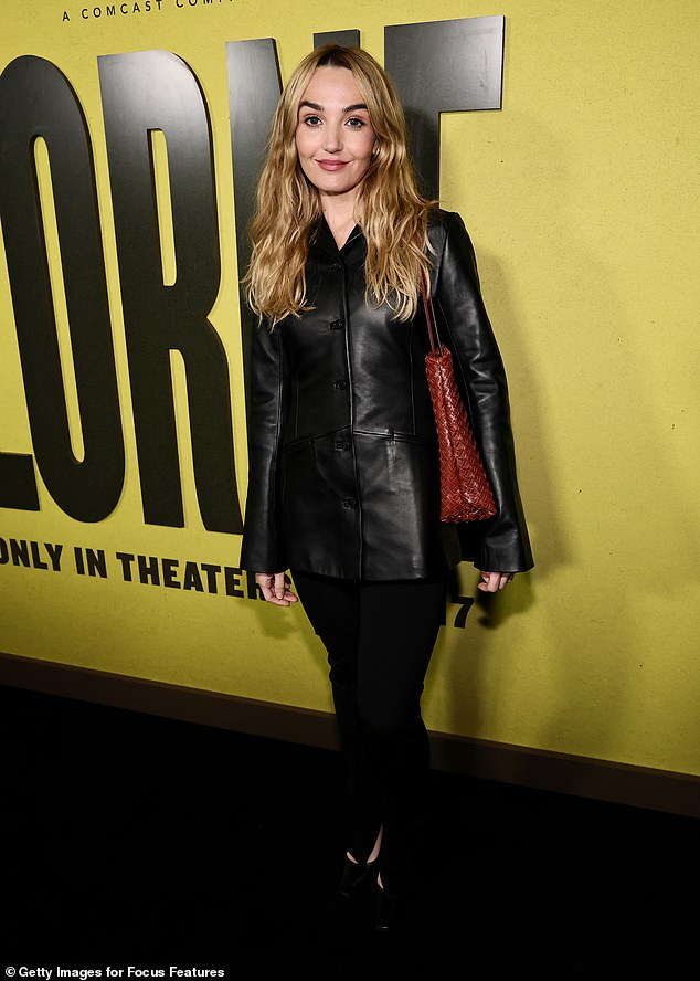 Saturday Night Live star Chloe Fineman smirked for shutterbugs while rocking a chic leather blazer and black pants