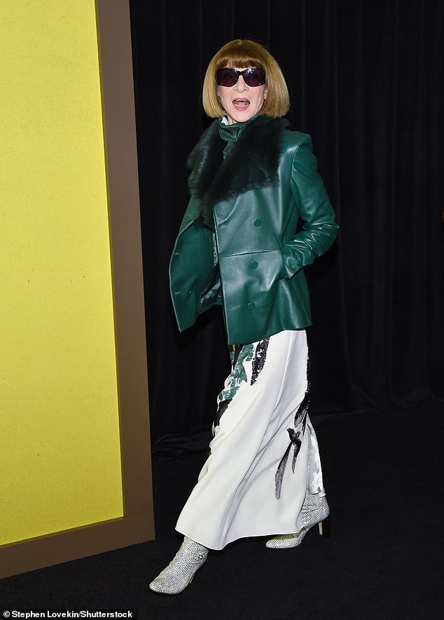 Vogue editor-in-chief Anna Wintour wowed onlookers in a chic green leather jacket with a black fur-trim collar and a flowing white skirt