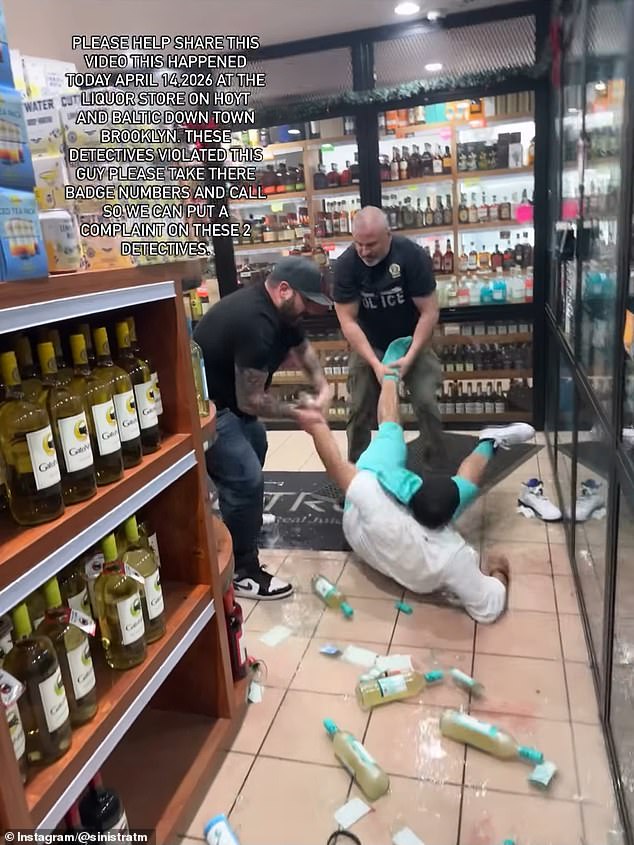 The detectives could be seen pulling the suspect by the legs before continuing to stomp and kick him